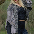 A stylish bohemian collar cape made from luxurious viscose fabric. Perfect for layering and adding a touch of elegance to any outfit.